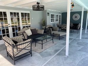 Lounge area on the newly remodeled lanai, with comfortable outdoor furniture.