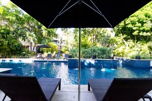 One of 4 swimming pools onsite to lounge and relax close to home! 