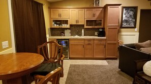 pub table and wet bar in living room