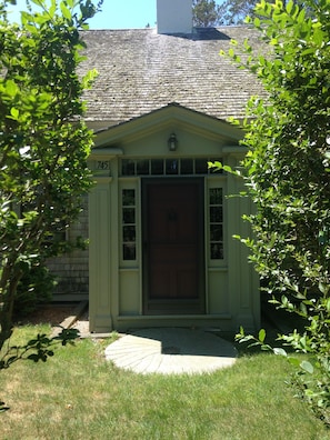 Front Door of the house with driveway to the left.