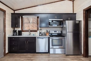 Kitchen Complete With Quartz Countertops And Stainless Steel Appliances!