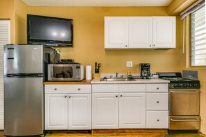 Kitchen with oven and large fridge