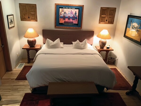 King size bed, side tables with USB charger, analog clock.