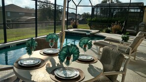 Enjoy dining poolside after a great day at the local parks.