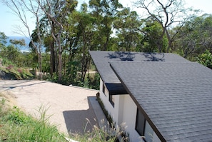 Birds eye view of house and ocean beyond