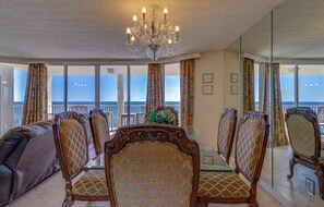 Ocean front dinning with well padded chairs and Murano hand sculpted chandelier.