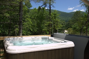 Hot tub on back with mountain view. 