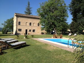 The garden has lots of space to relax with  enough sun loungers for everyone.