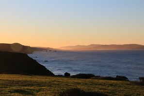 View from the home with rock out croppings and Point Reyes off in the distance.