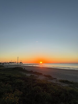 Picture yourself at the beach at sunrise just across street from Seawall Cabana.