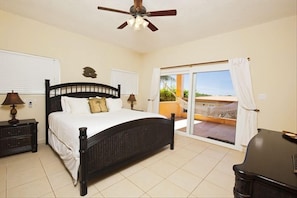 Tommy Bahama king bed in the master bedroom with a Caribbean view from the bed 