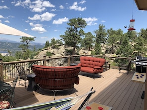 Large deck, fire pit, table and chairs, natural gas grill, views every direction