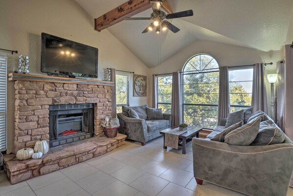 Living Room with Fireplace and Large TV..HUGE walls of windows watch the Deer!