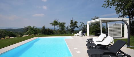 Pool with gazebo beach chairs