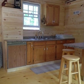 Beautiful kitchen equipped with LP gas cook stove & under-counter refrigerator.