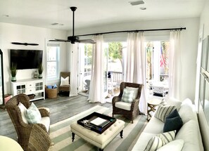 Lower living room, with 3 french doors, pull out queen couch & 60" smart HDTV 