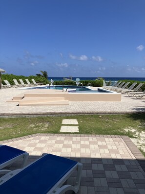 Your Private Patio with Chaise Lounges; the Pool; the Ocean. All Within Steps!