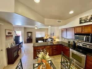 Open concept kitchen with modern appliances.