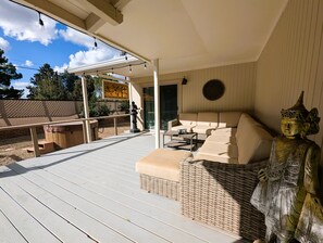 Rear deck lounge seating with long view to Thunder mountain