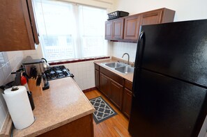 Kitchen With Everything Needed To Prepare And Serve A Meal