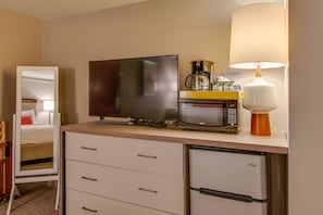 Dresser, flat screen, mini fridge, coffee maker, and microwave