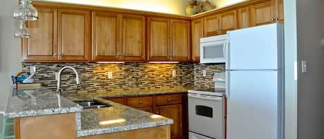 Updated kitchen with mosaic backsplash.