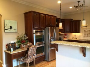 Gourmet kitchen with all SS. KitchenAid double oven. 5-burner Thermador cooktop.