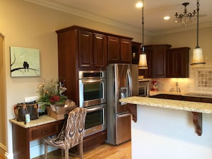 Gourmet kitchen with all SS. KitchenAid double oven. 5-burner Thermador cooktop.