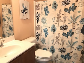Full bath in hall shared with 2 bedrooms.