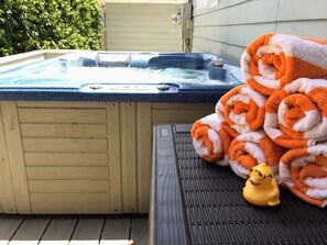 Unwind in the hot tub at the end of the day. Hot tub is made to seat three with a lounge seat, but can easily accommodate more.