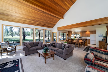 Spacious family room with plenty of room for everyone. Pellet stove will keep you warm and cozy in the winter months. Large TV with DVD. Several large windows open up the view to the deck and golf course (#8 Big Meadow).