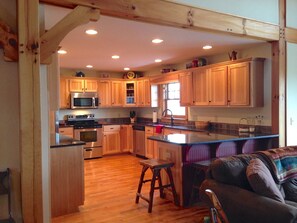 Large, generously-stocked kitchen with stainless appliances