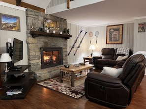 A stacked stone fireplace with gas logs makes this the perfect spot to unwind.