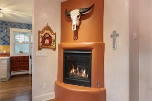 Gas fireplace with hand-carved water buffalo skull.