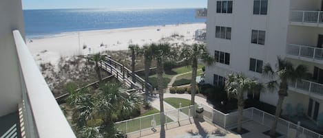 Views of the pool and beach from the balcony.