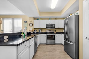 Recently remodeled kitchen with stainless appliances &  new plank flooring 