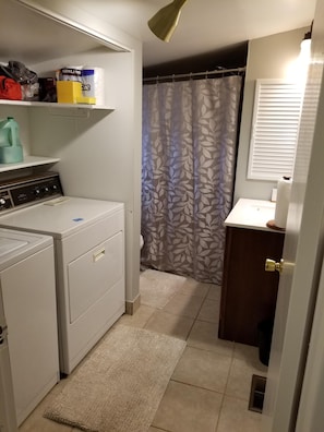 2nd bathroom with washer and gas dryer.