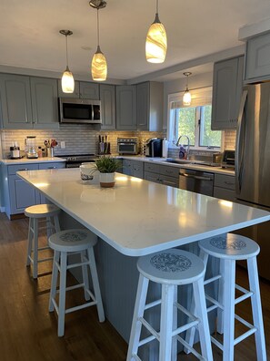 Remodeled Kitchen With New Counter Tops, Back Splash & Stove