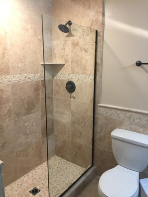 New Master Bath, travertine tile, walk in shower, etc.