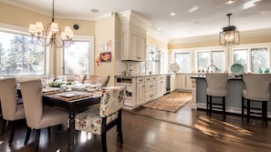 Kitchen dining and large bar leads to expansive treks deck.