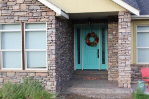 Front entrance and trademark turquoise door
