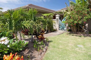 This property is surround by lush tropical fruit trees, plumeria and palm trees
