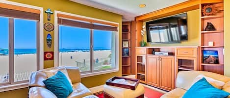 Living room with ocean, beach and strand view.  Smart TV with cable and Wi-Fi