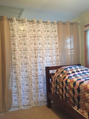 Privacy curtain closed giving the queen size bed area extra privacy