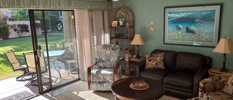 Comfortable chairs and leather couch. We are on ground floor with shady lanai.