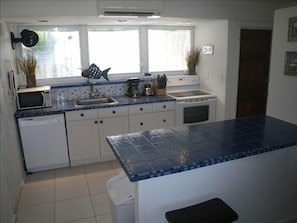 Newly updated caribbean kitchen and mahogany doors.