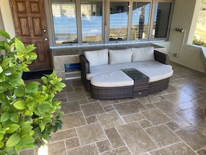 Stunning travertine patio overlooks the Caribbean Sea.