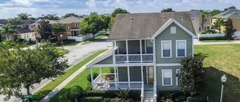 Front elevation featuring two furnished porches