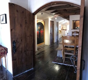 Handcrafted artisanal doors to master bedroom adds a sense of grandeur.