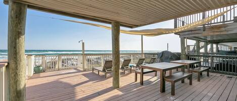 Beach level deck, lounge chairs, dining tables and more seating!